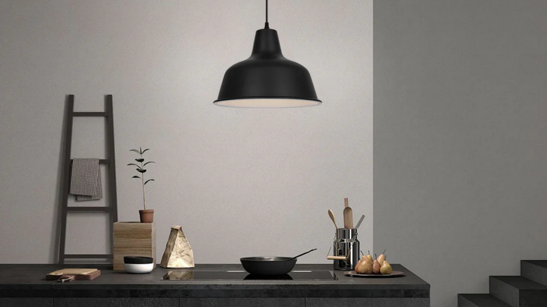 Coolilumi Pot Lid Lamp illuminating a modern kitchen countertop.