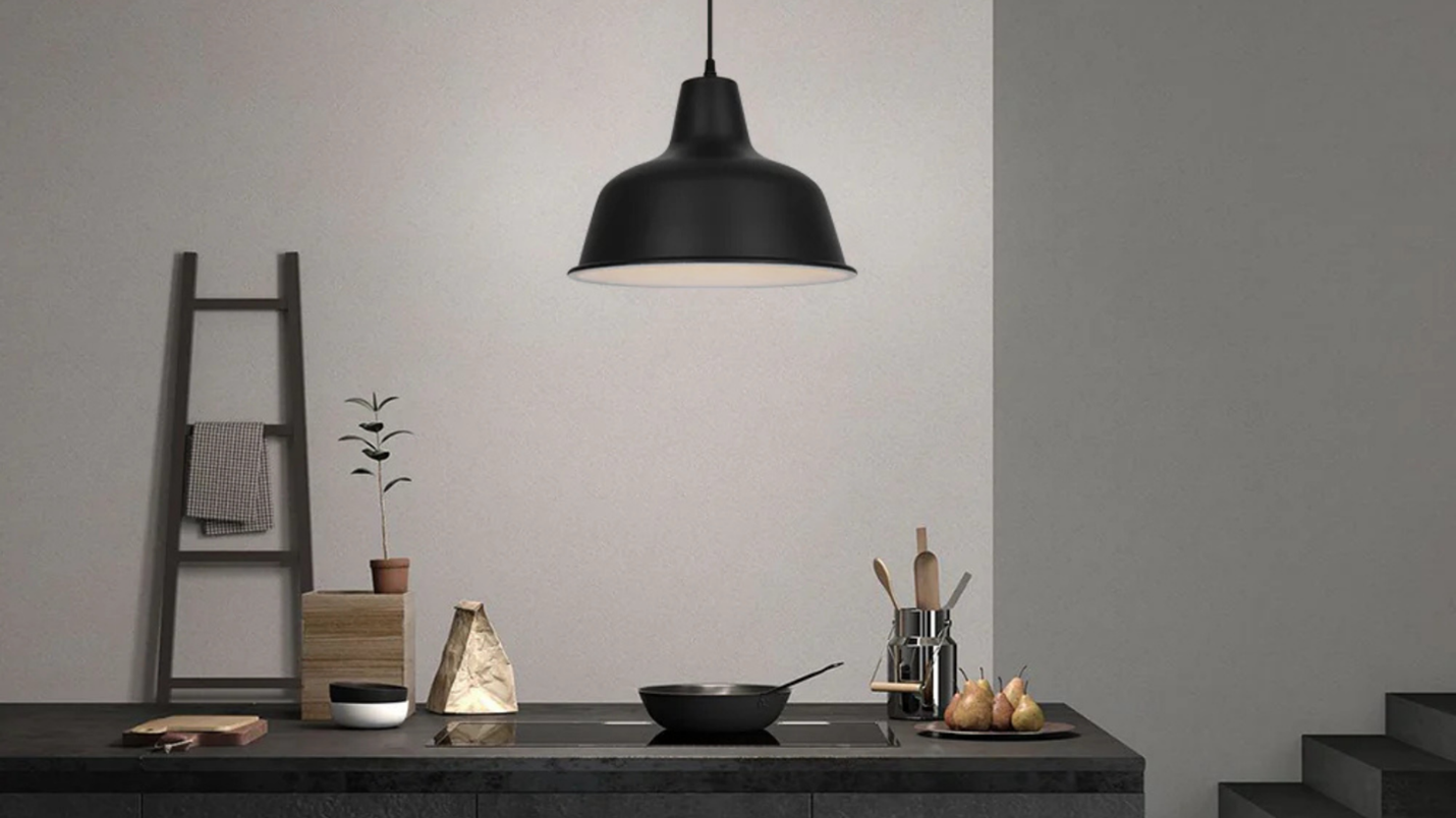 Coolilumi Pot Lid Lamp illuminating a modern kitchen countertop.