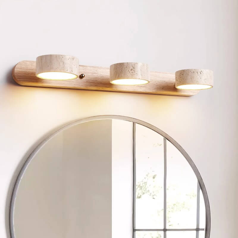 Coolilumi Travertine Wall Light in front of bathroom mirror, adjustable solid wood wall lamp for stylish and functional mirror lighting.