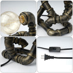 Closeup Details of Bronze Robot Table Lamp: Vintage Pipe Joints, Globe Bulb Connector, On/Off Switch & Plug | Sturdy Metal Construction for Steampunk Home/Office Decor